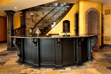 Example of a large classic galley slate floor and multicolored floor wet bar design in Kansas City with black cabinets, granite countertops and black backsplash