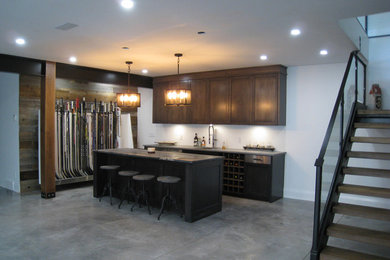 Example of a trendy home bar design in Toronto