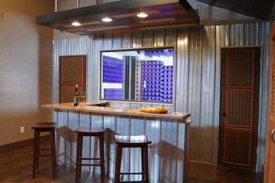 Inspiration for a mid-sized industrial l-shaped home bar remodel in DC Metro with granite countertops