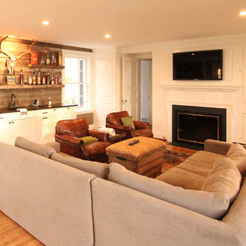 Family Room Bar with Barn Wood Paneled Backsplash and Floating Shelves