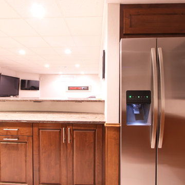 Full Depth Refrigerator Built Into Alcove in Home Bar