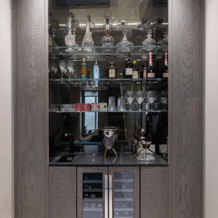 This is an example of a contemporary home bar in London.