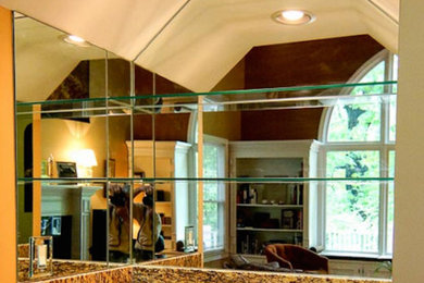 Example of a large home bar design in Atlanta with a drop-in sink and granite countertops