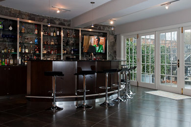 Photo of a large contemporary home bar in New York.