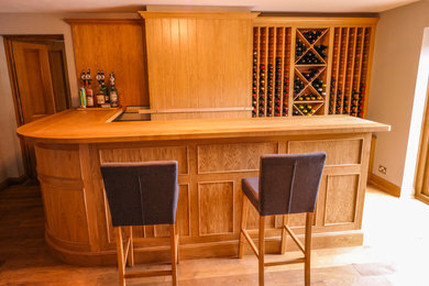 Design ideas for a medium sized classic wet bar in Gloucestershire with beaded cabinets and wood worktops.