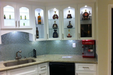 Seated home bar - mid-sized traditional single-wall seated home bar idea in Atlanta with an undermount sink, shaker cabinets, white cabinets, granite countertops, blue backsplash and mosaic tile backsplash