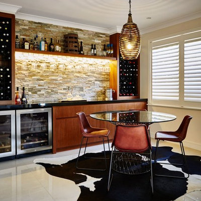 Inspiration for a contemporary single-wall white floor home bar remodel in Central Coast with flat-panel cabinets, medium tone wood cabinets and beige backsplash