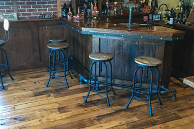 This is an example of a rustic home bar in New York.