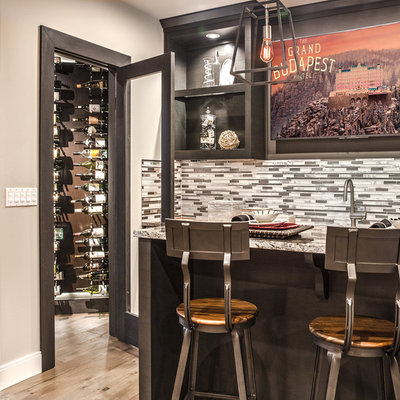Example of a trendy light wood floor seated home bar design in Seattle with open cabinets, dark wood cabinets, multicolored backsplash, matchstick tile backsplash and multicolored countertops