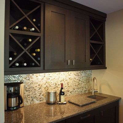 Mid-sized trendy single-wall seated home bar photo in Chicago with an undermount sink, shaker cabinets, dark wood cabinets, brown backsplash and mosaic tile backsplash