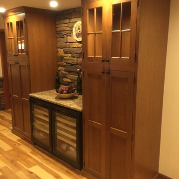Kitchen with stone and wine fridges