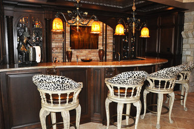 Seated home bar - large transitional galley ceramic tile seated home bar idea in Other with raised-panel cabinets, dark wood cabinets, granite countertops and beige backsplash
