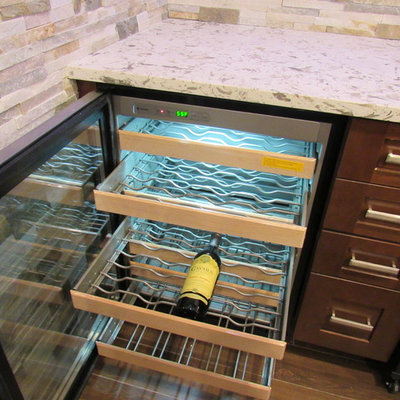 Example of a large trendy galley porcelain tile wet bar design in New York with an undermount sink, shaker cabinets, dark wood cabinets, granite countertops, multicolored backsplash and stone tile backsplash