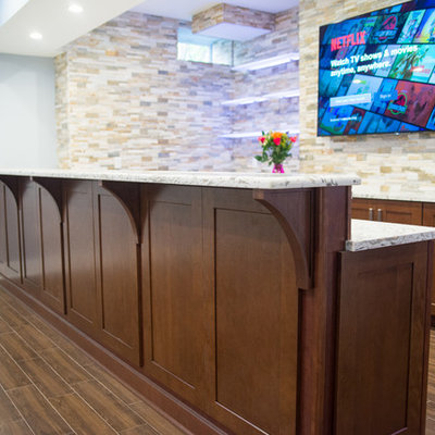 Wet bar - large contemporary galley porcelain tile wet bar idea in New York with an undermount sink, shaker cabinets, dark wood cabinets, granite countertops, multicolored backsplash and stone tile backsplash