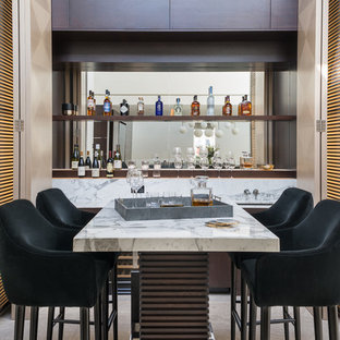 Photo of a medium sized contemporary breakfast bar in London with open cabinets, marble worktops, mirror splashback, white worktops, a submerged sink and grey floors.