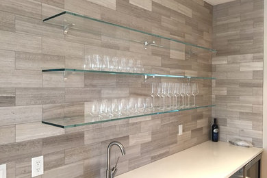 Photo of a medium sized contemporary home bar in New York.