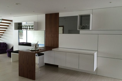 This is an example of a contemporary home bar in Dorset.