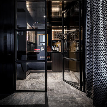 Moody mirror & timber panelled wine cellar with steel doors