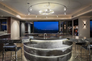 Example of a trendy single-wall dark wood floor and brown floor seated home bar design in Phoenix with open cabinets, dark wood cabinets and marble countertops