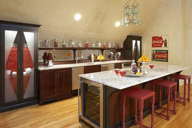 Example of a large eclectic galley medium tone wood floor seated home bar design in Chicago with an undermount sink, shaker cabinets, dark wood cabinets, marble countertops and mirror backsplash