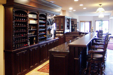Mid-sized elegant travertine floor home bar photo in Cleveland