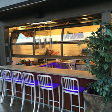 Patio Enclosed with Full Vision Glass/Aluminum Garage Doors