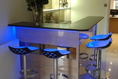 Contemporary home bar in Other.