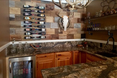 Example of an arts and crafts home bar design in Other