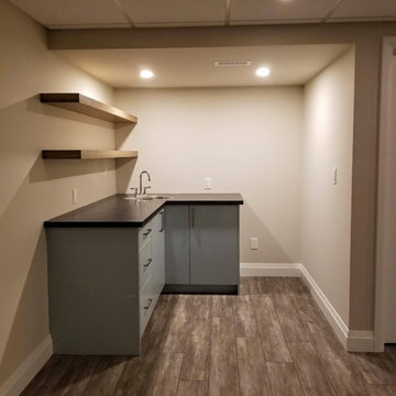 Refinished Basement with Baby Blue Walk-Up Bar