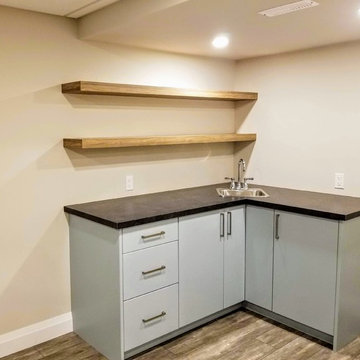 Refinished Basement with Baby Blue Walk-Up Bar