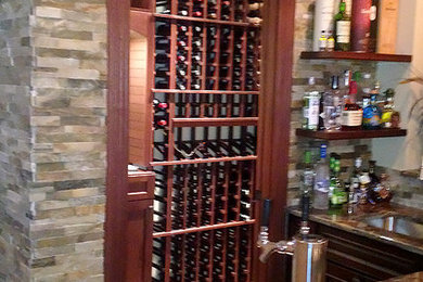 Inspiration for a mid-sized contemporary wine cellar remodel in New York