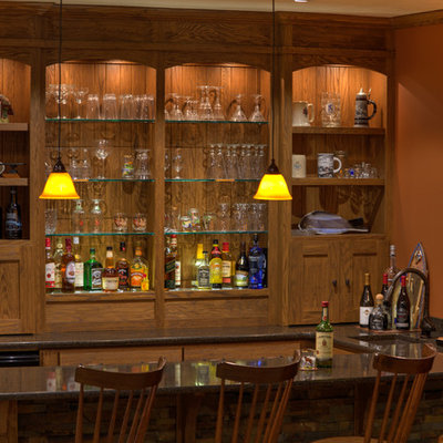 Inspiration for a mid-sized rustic u-shaped seated home bar remodel in Other with an undermount sink, open cabinets, medium tone wood cabinets, granite countertops, brown backsplash and wood backsplash