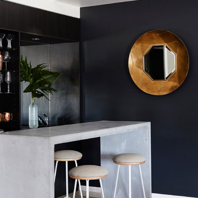 Trendy galley seated home bar photo in Other with open cabinets, black cabinets and concrete countertops