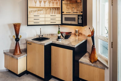Trendy single-wall wet bar photo in Seattle with an undermount sink, flat-panel cabinets and light wood cabinets
