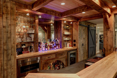 This is an example of a rustic home bar in Atlanta.