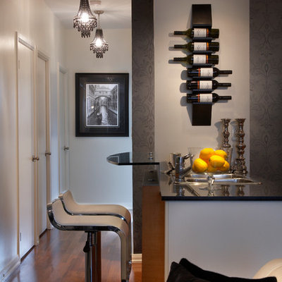 Seated home bar - contemporary dark wood floor seated home bar idea in Toronto with a drop-in sink