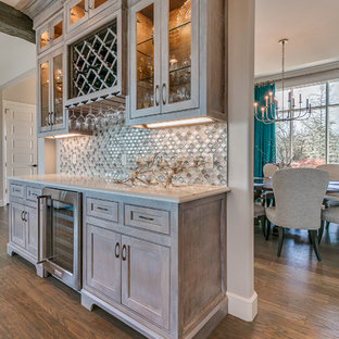 Example of a huge farmhouse single-wall light wood floor and brown floor wet bar design in Oklahoma City with no sink, shaker cabinets, light wood cabinets, quartz countertops, gray backsplash and mosaic tile backsplash