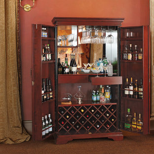 Immagine di un piccolo angolo bar chic con consolle stile comò, ante in legno bruno, nessun lavello, top in legno e paraspruzzi a specchio