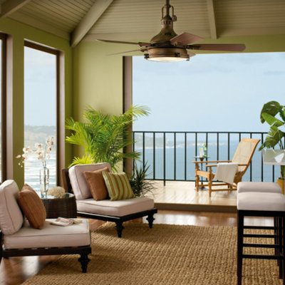 Mid-sized beach style galley medium tone wood floor seated home bar photo in New York with quartz countertops