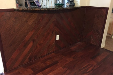 Using flooring to create accent wall under bar area