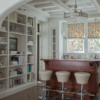 Seated home bar - coastal medium tone wood floor seated home bar idea in Houston with white cabinets
