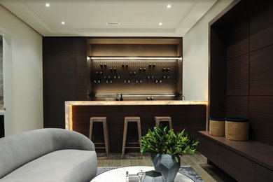Medium sized contemporary single-wall breakfast bar in Vancouver with a submerged sink, dark wood cabinets, marble worktops, porcelain flooring, grey floors and white worktops.