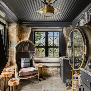 Imagen de bar en casa tradicional renovado con armarios con paneles empotrados, puertas de armario negras, suelo multicolor y encimeras multicolor