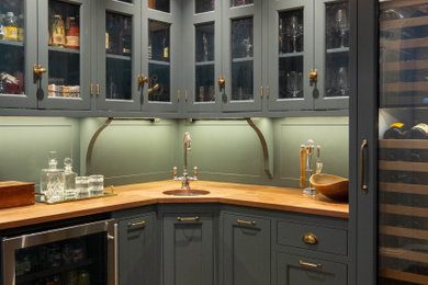 Inspiration for a transitional home bar remodel in Boston with beaded inset cabinets