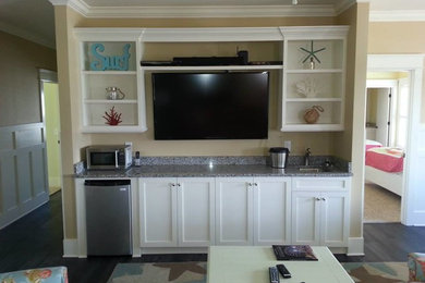 Example of a home bar design in Other