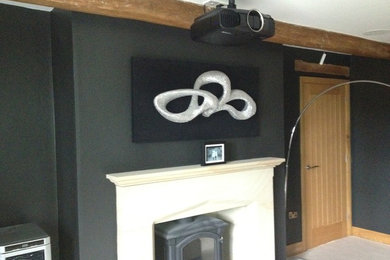 This is an example of a modern home cinema in Other.