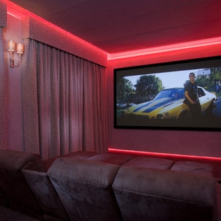 Inspiration for a contemporary enclosed home cinema in London with grey walls and carpet.