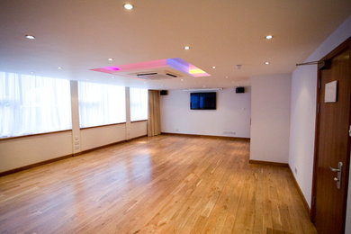 This is an example of a contemporary home cinema in Buckinghamshire.