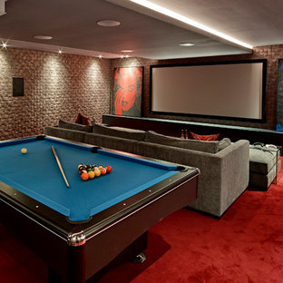 Inspiration for a contemporary open plan home cinema in London with carpet, a projector screen and red floors.