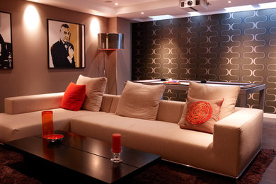 Medium sized contemporary enclosed home cinema in London with brown walls, dark hardwood flooring and a projector screen.